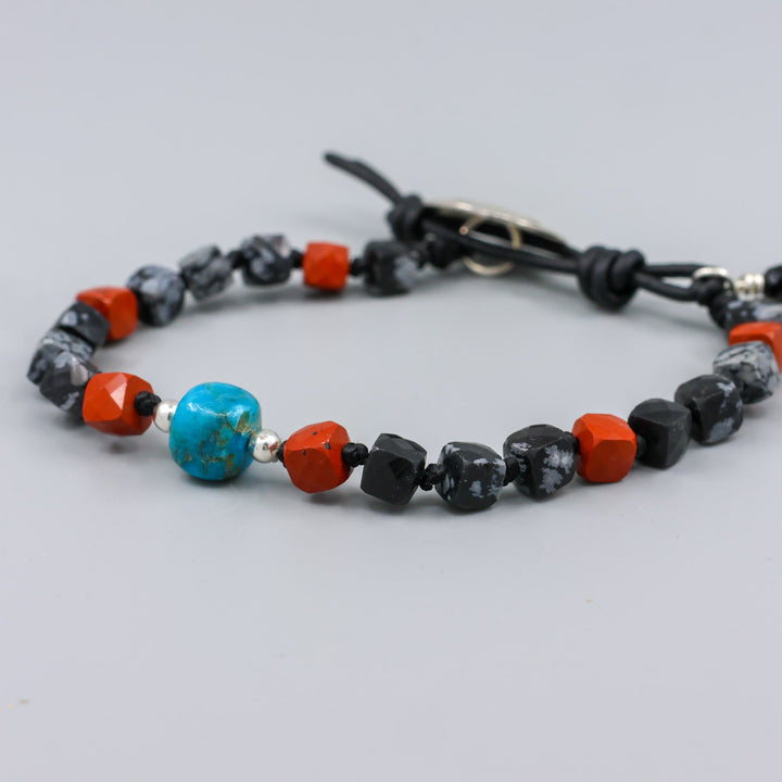 handmade turquoise, jasper, and larvikite beaded bracelet with a star-stamped sterling silver button closure  detail view