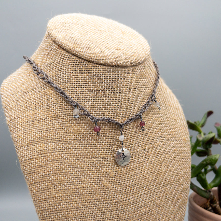 crochet  star medallion necklace with garnet, labradorite, and moonstone beads