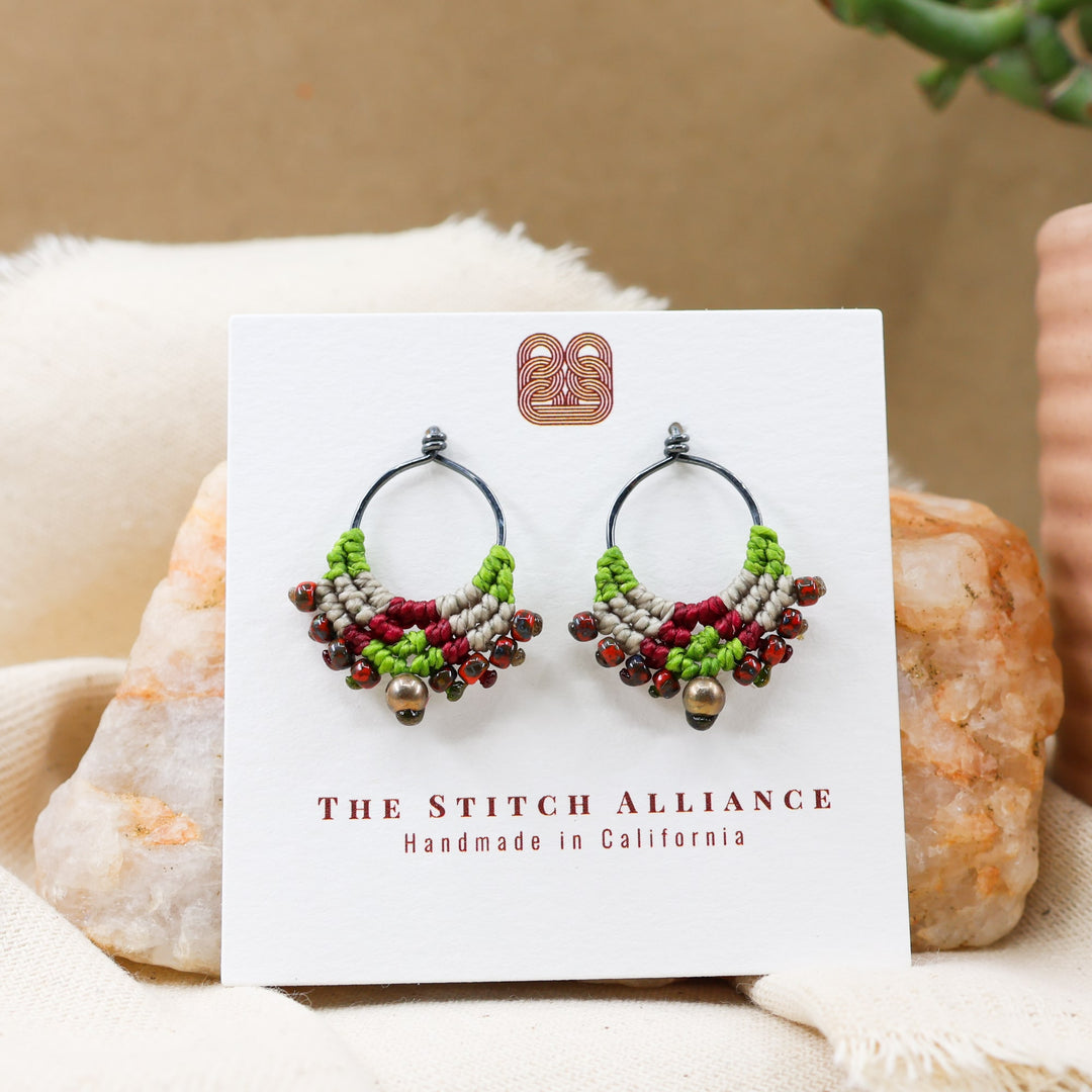 green and red macrame earrings with oxidized sterling silver on a white card