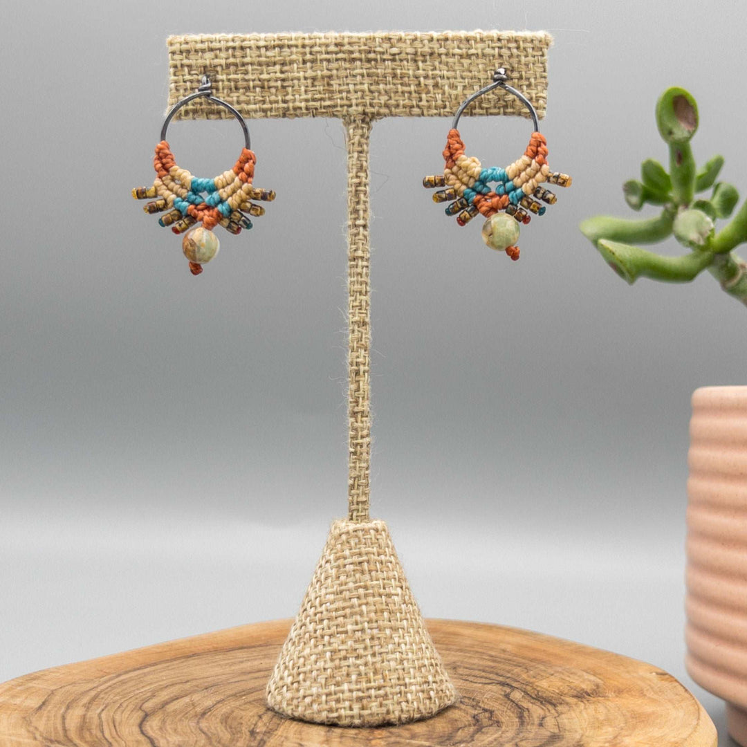 oxidized sterling silver macrame post style earrings. Sedona-inpired colors with aqua terra jasper beads shown hanging from linen earring tree