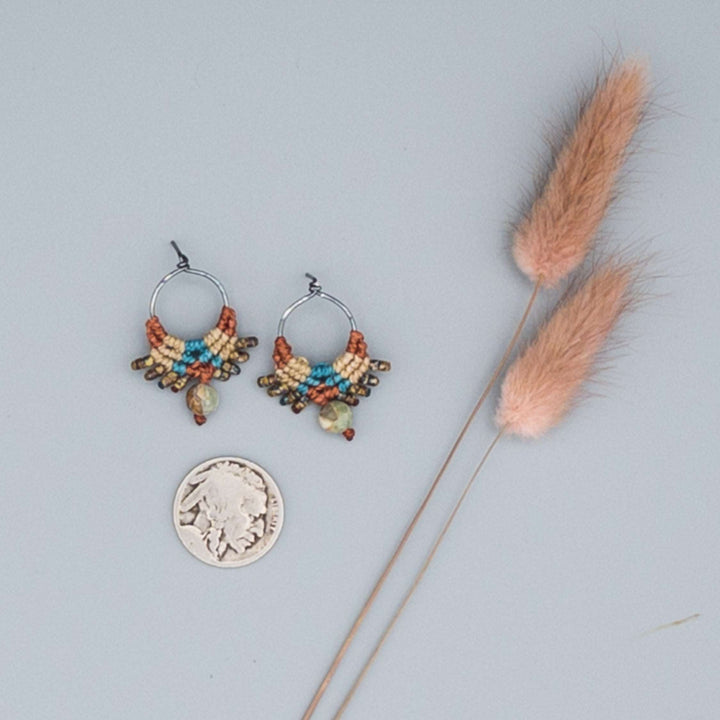 oxidized sterling silver macrame post style earrings. Sedona-inpired colors with aqua terra jasper beads shown on a gray background with a buffalo nickle for size comparison