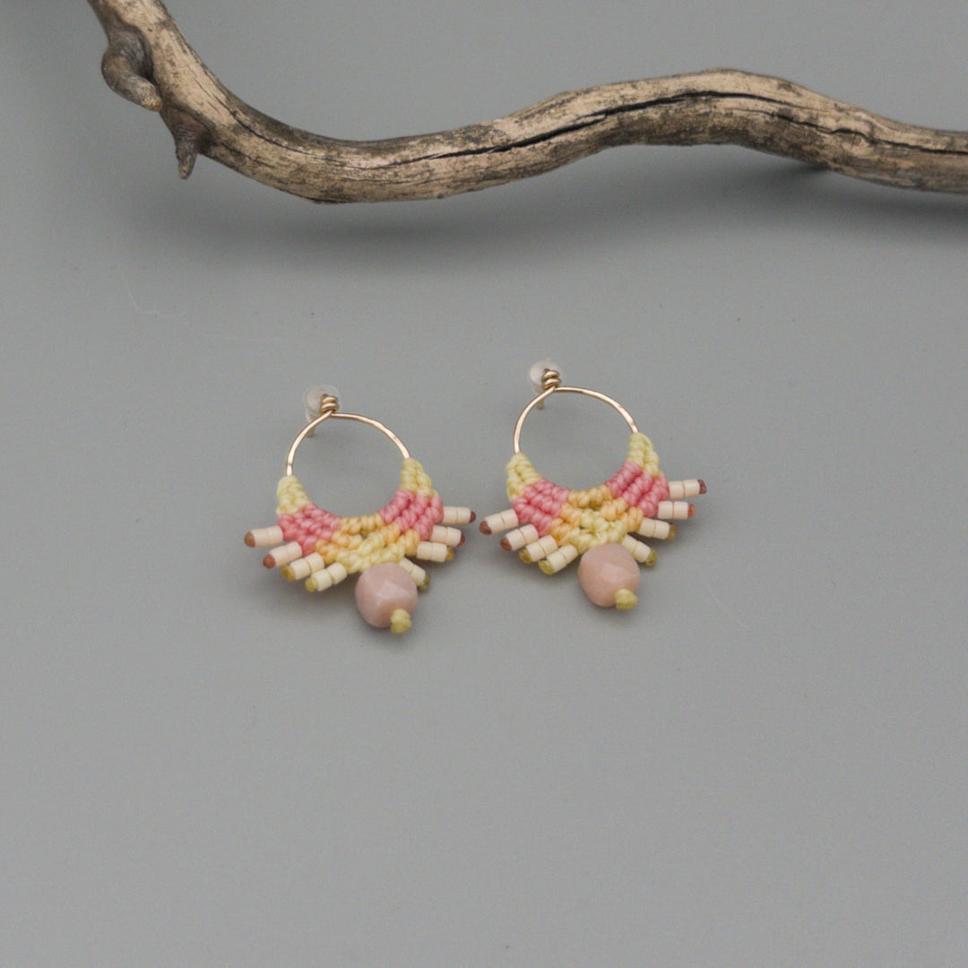pink and yellow macrame earrings gold fill pink opal bead on a gray background