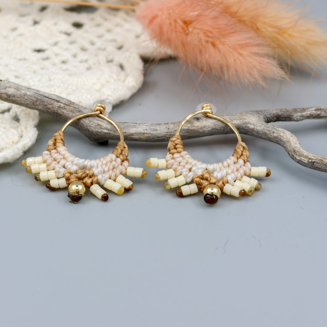 detail image of handmade macrame earrings with gold fill wire in tan colors