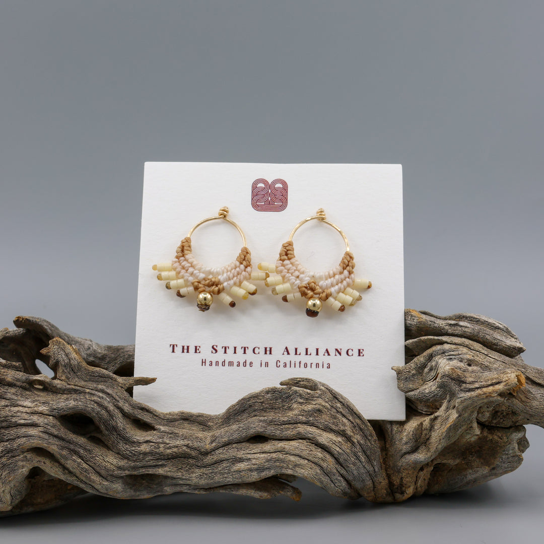 handmade macrame earrings with gold fill wire in tan colors on a white card