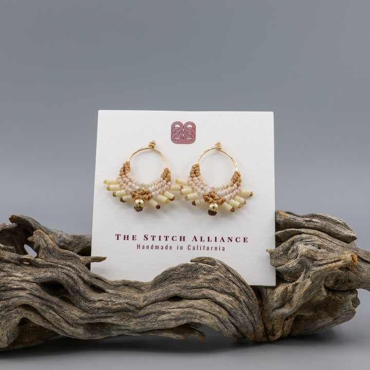 handmade macrame earrings with gold fill wire in tan colors on a white card