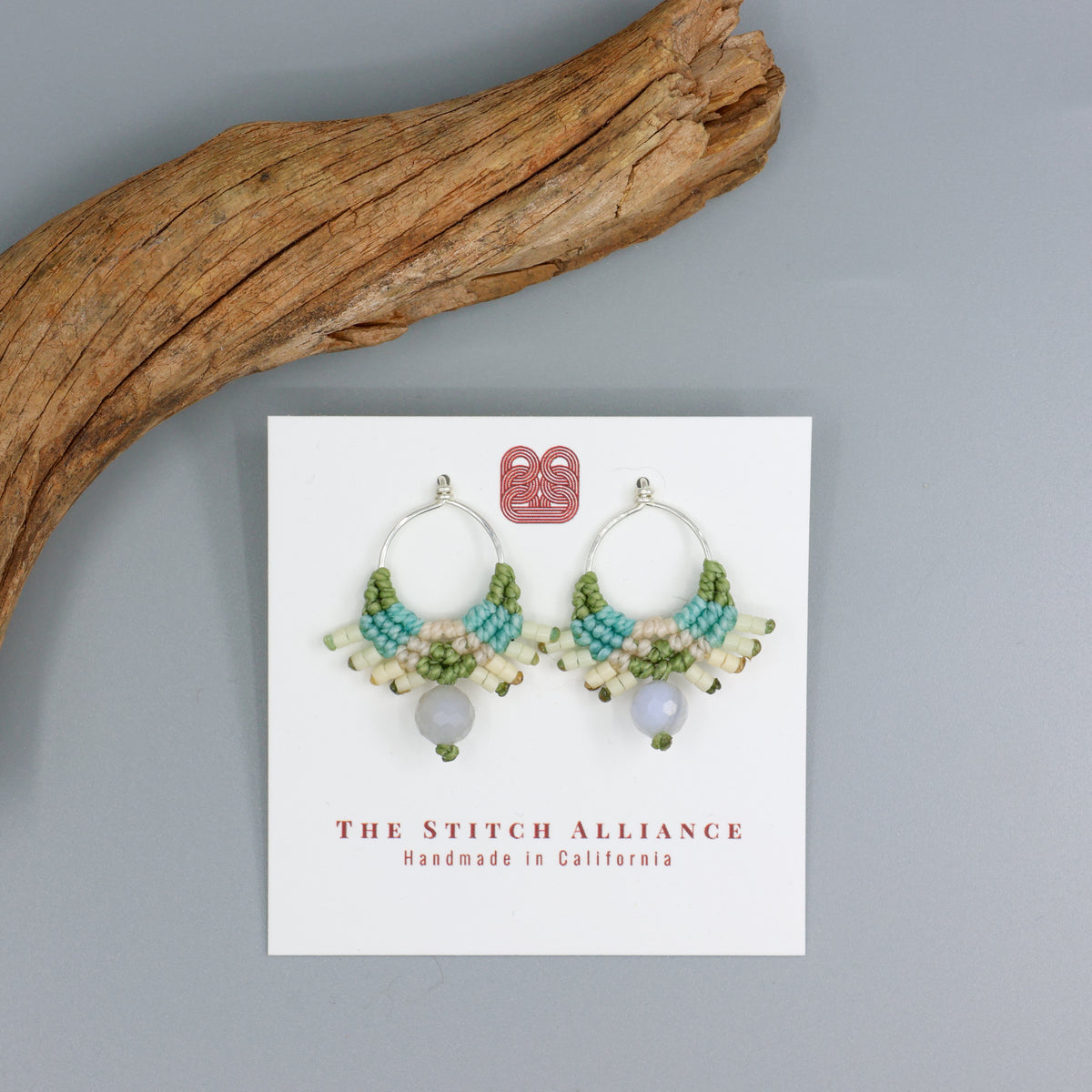 handmade macrame sterling silver drop earrings with blue lace agate beads on a white card