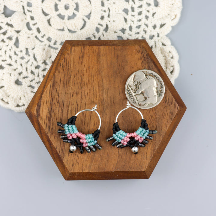 sterling silver macrame stud drop earrings with black, blue, and pink with a nickel for size comparison