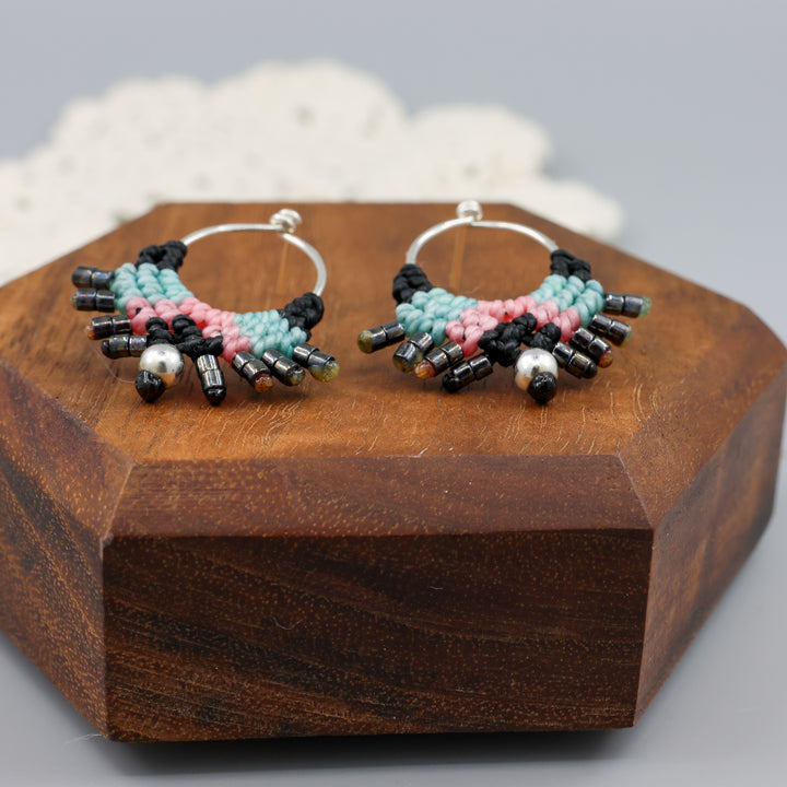 close up view of sterling silver macrame stud drop earrings with black, blue, and pink