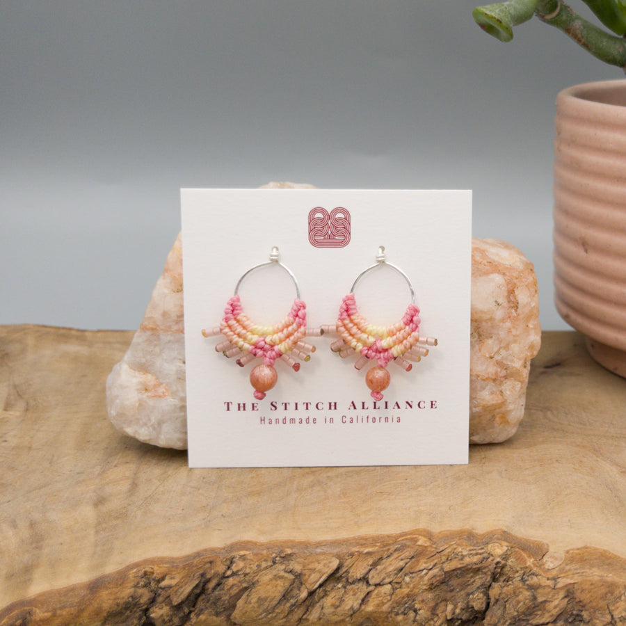 pink & yellow macrame earrings sterling silver with a sunstone bead on a white card