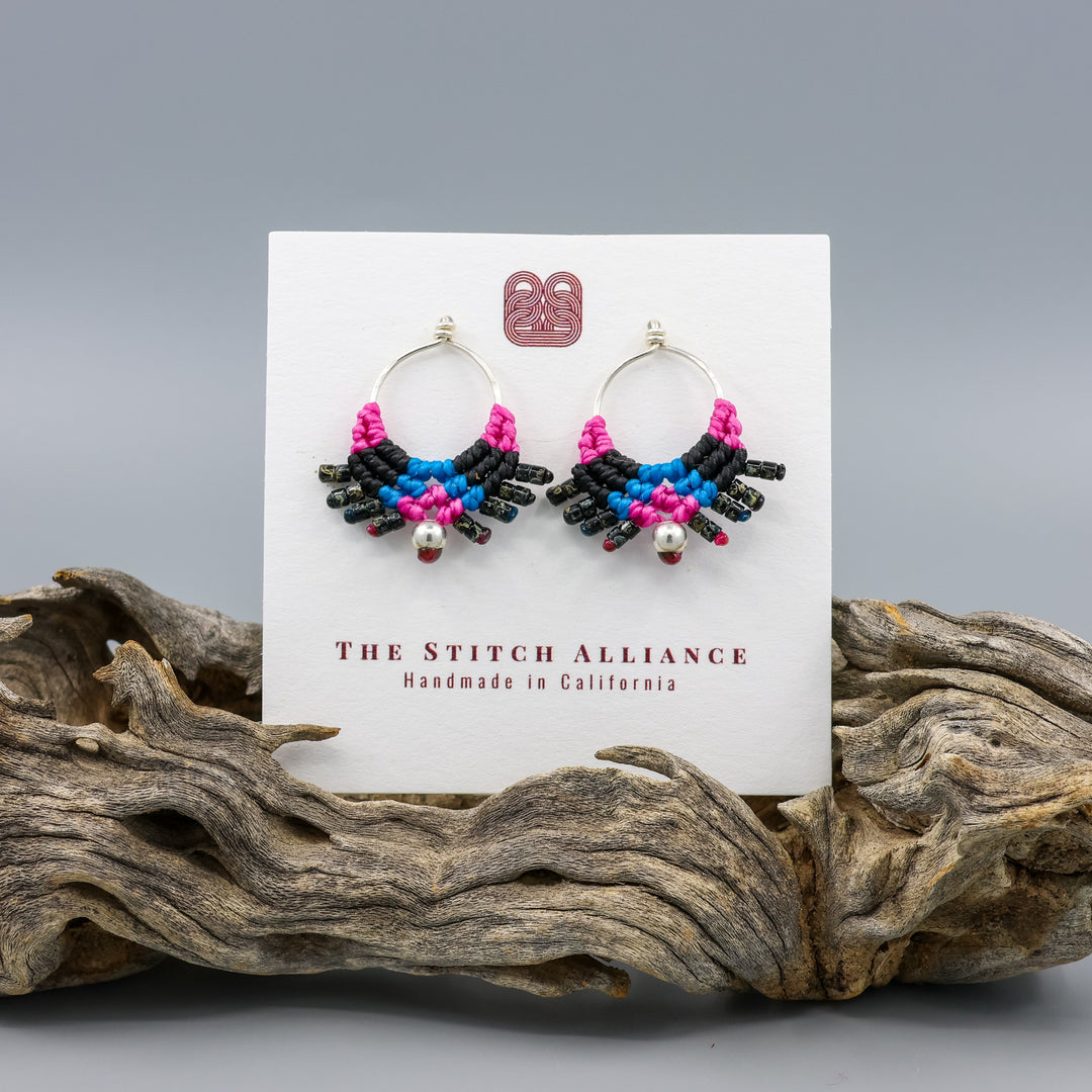 handmade sterling silver macrame earrings in bright pink, bright blue, and black on a white card
