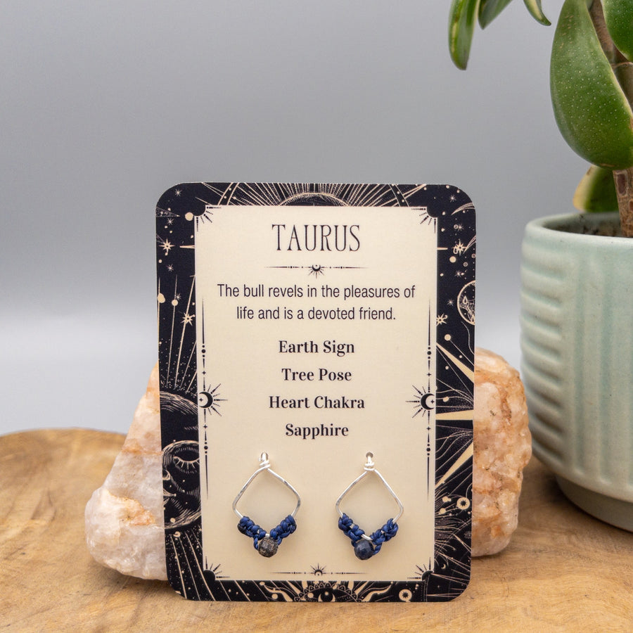 Taurus sapphire earrings in sterling silver on a gift card
