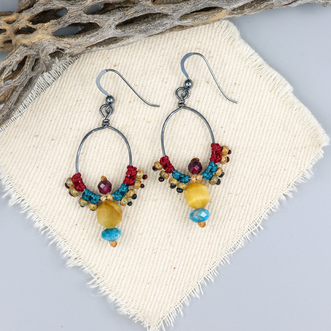 handmade oxidized sterling silver macrame hoop earrings with golden tiger's eye, apatite, and garnet beads