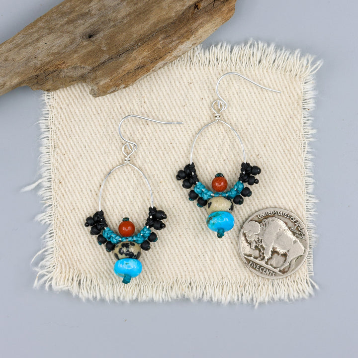 turquose and jasper handmade sterling silver macrame earrings with a nickel for size comparison