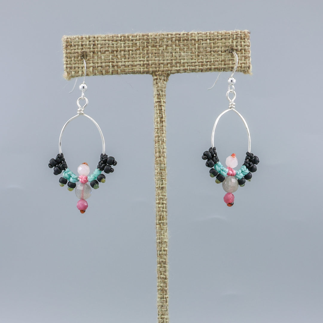 handmade sterling silver macrame hoop earrings with labradorite, tourmaline, and moonstone beads on a linen hanger