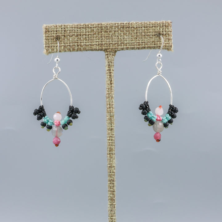 handmade sterling silver macrame hoop earrings with labradorite, tourmaline, and moonstone beads on a linen hanger
