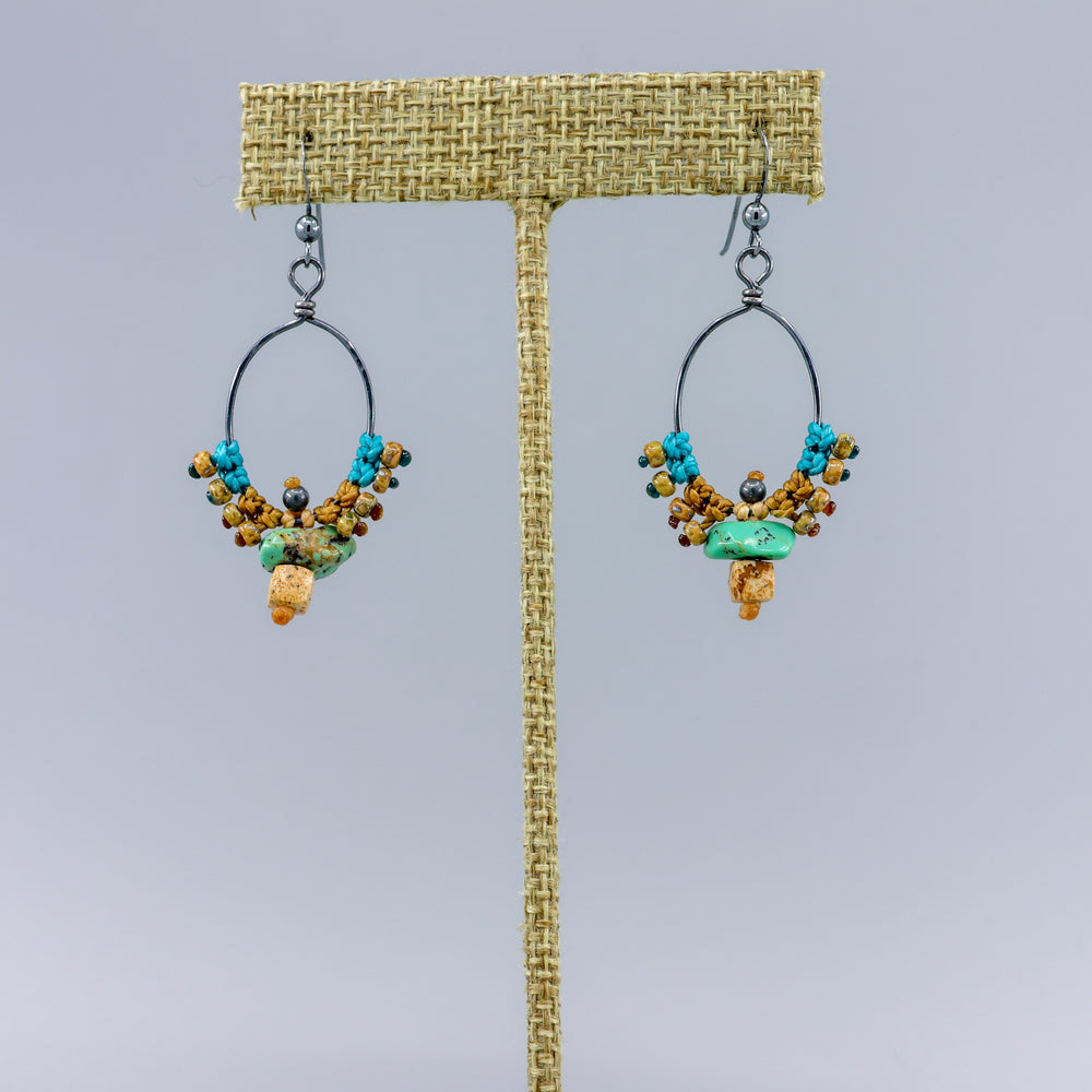handmade oxidized sterling silver hoops with macrame, turquoise, and picture jasper on a linen hanger