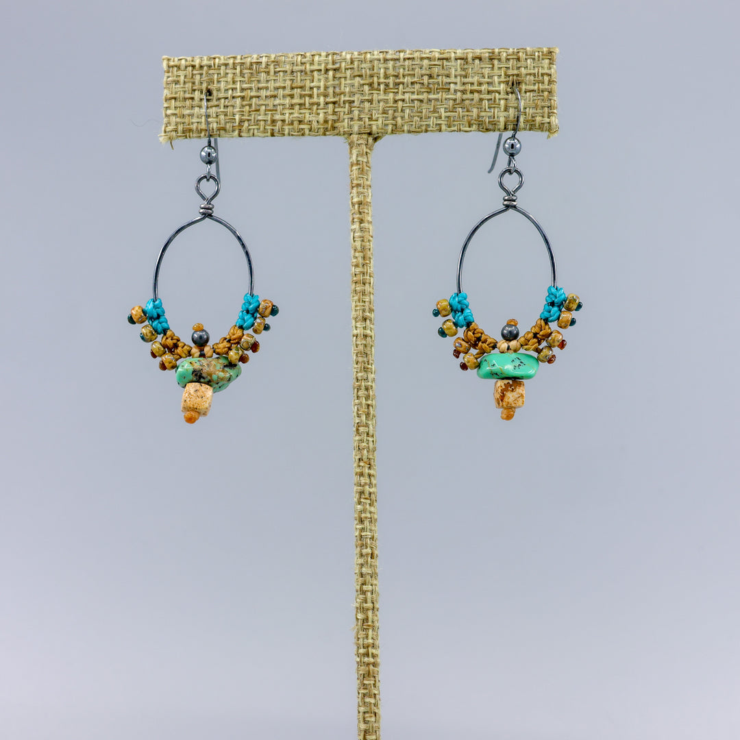 handmade oxidized sterling silver hoops with macrame, turquoise, and picture jasper on a linen hanger