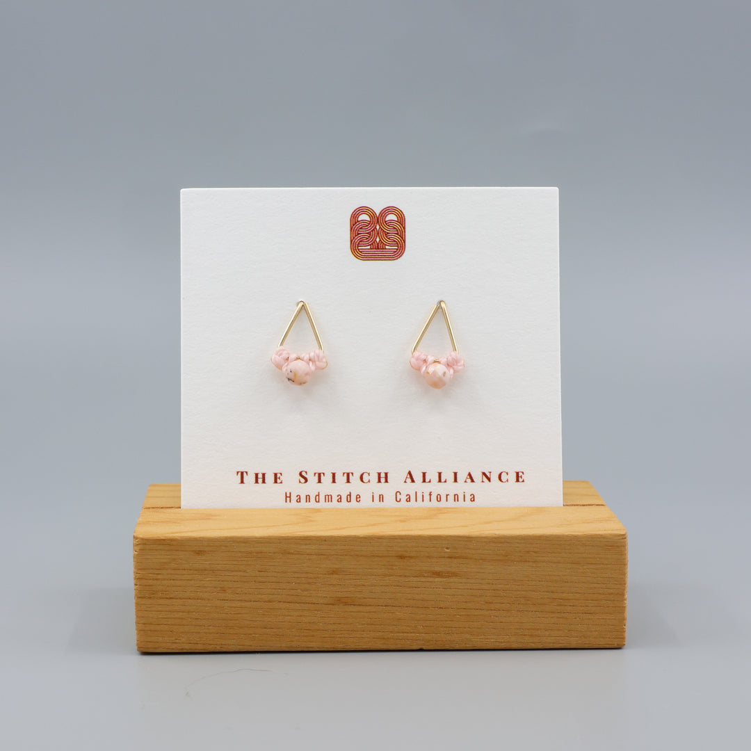 pink opal stud earrings gold fil on a white card