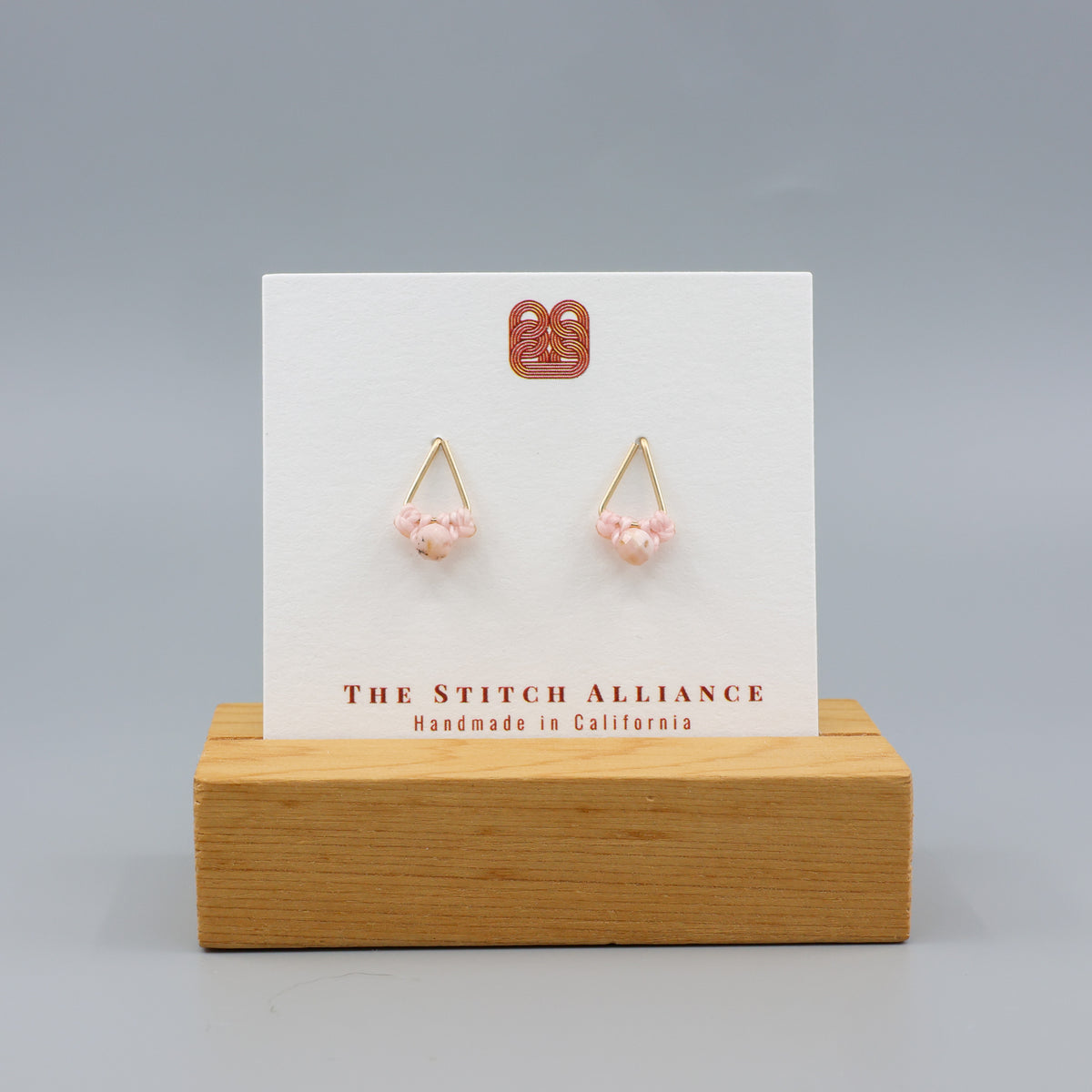 pink opal stud earrings gold fil on a white card