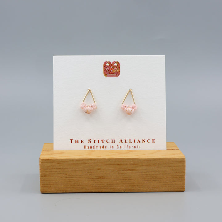 pink opal stud earrings gold fil on a white card