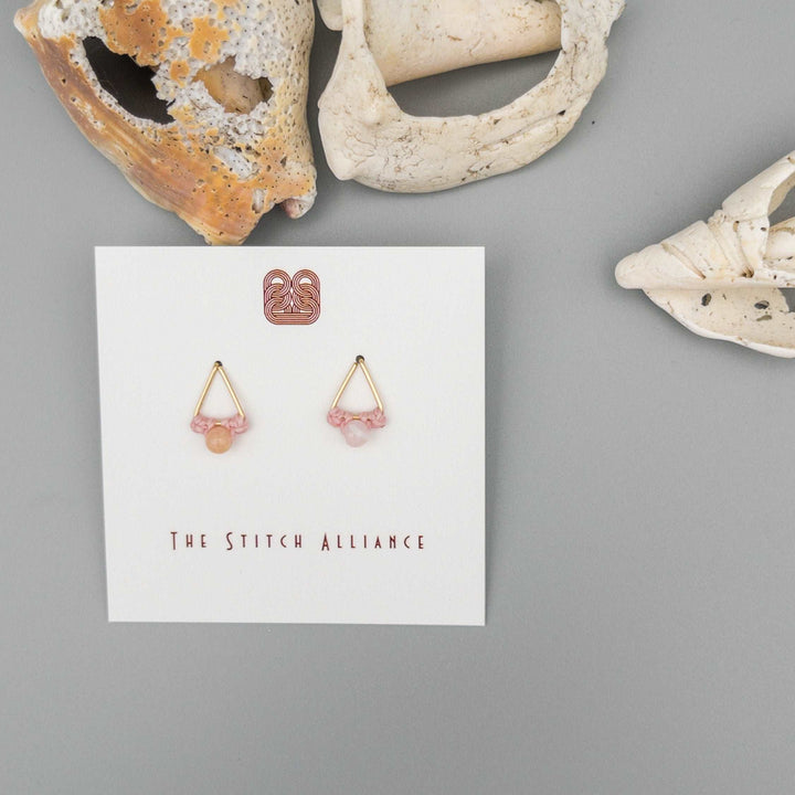 14k gold filled triangle shaped post-style earrings with a 4mm pink opal bead