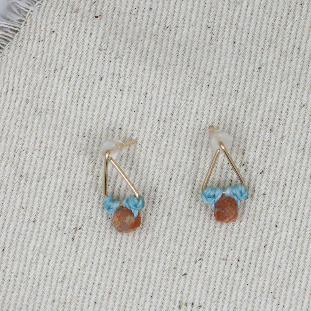 14k gold fill and sunstone stud earrings flat lay