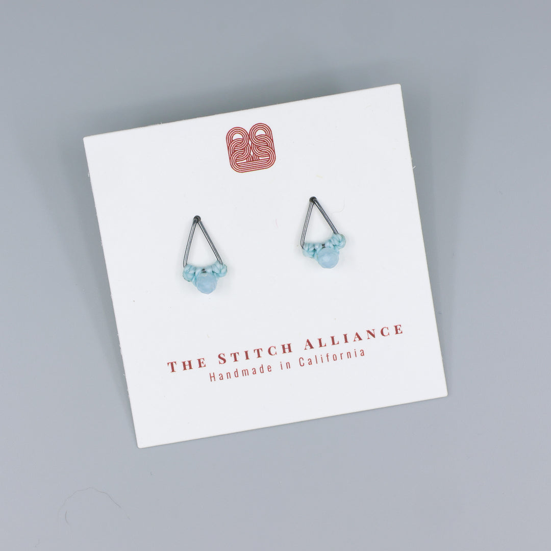 handmade triangle stud earrings oxidized sterling silver on a white display card