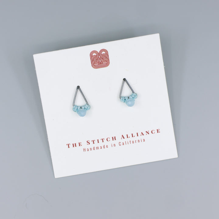 handmade triangle stud earrings oxidized sterling silver on a white display card
