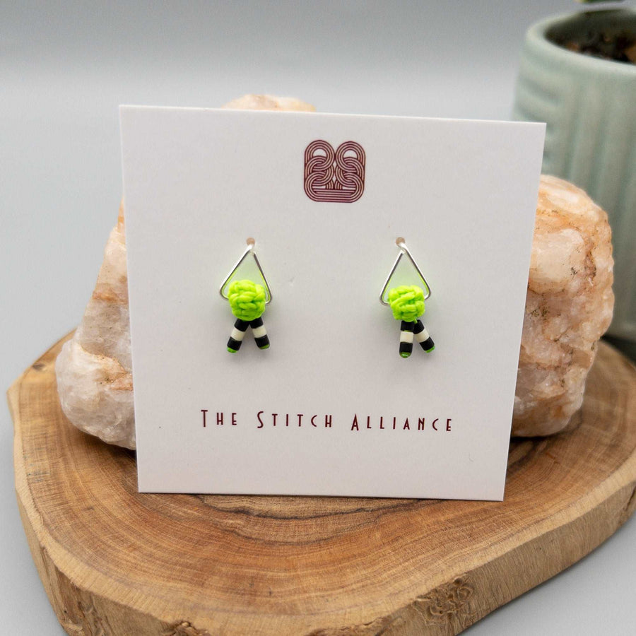 Sterling silver triangle post style earrings with neon green macrame thread and black and white seed beads