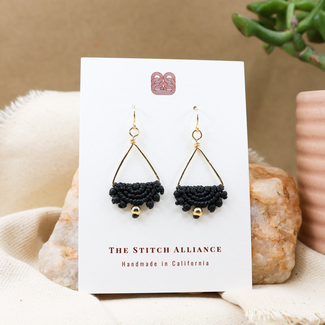 gold filled triangle hoop macrame earrings in black on a white card