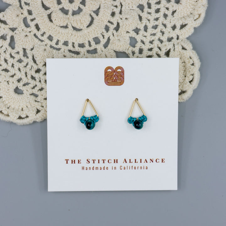 handmade blue tiger's eye triangle stud earrings in gold fill wire on a white display card