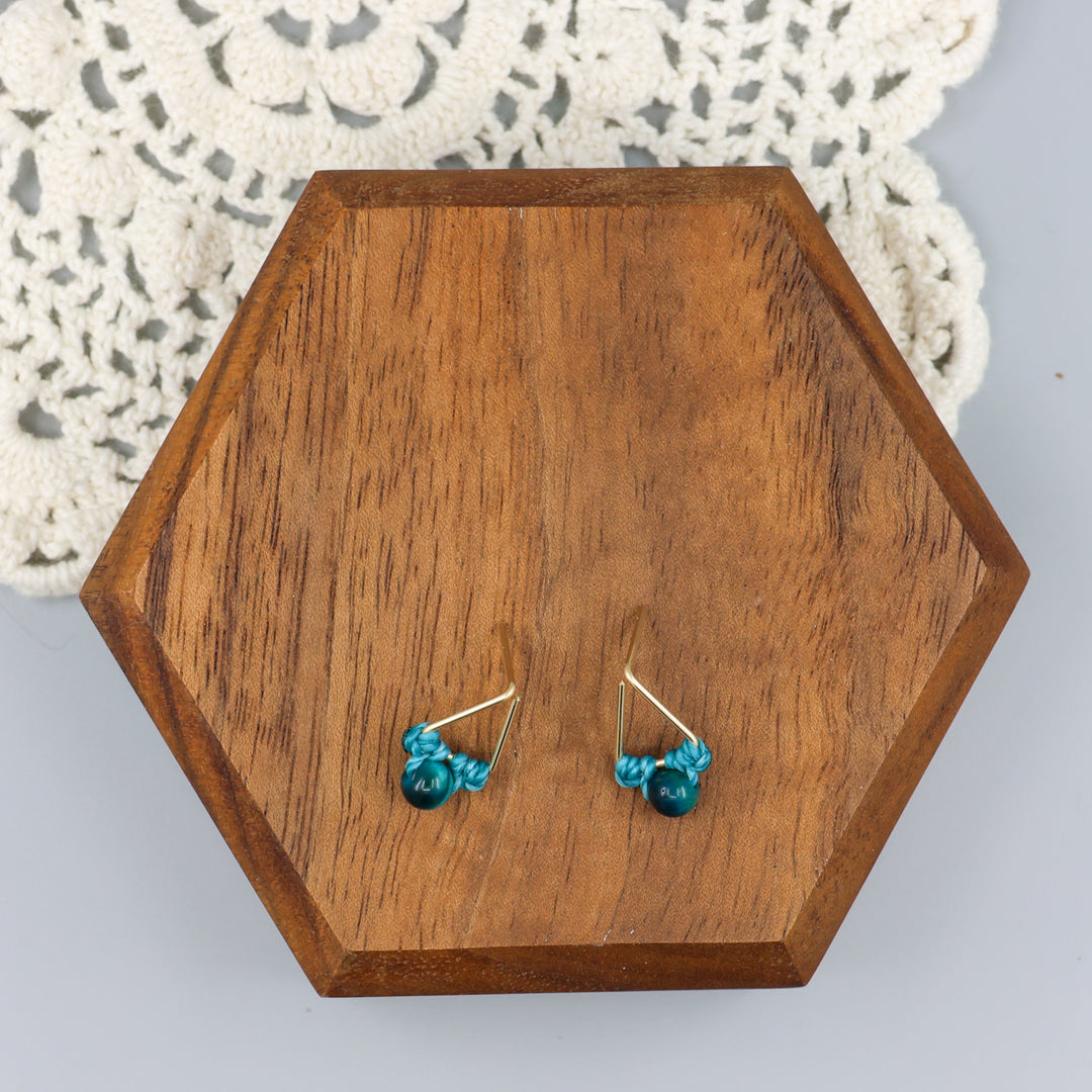 handmade blue tiger's eye triangle stud earrings in gold fill wire overhead view