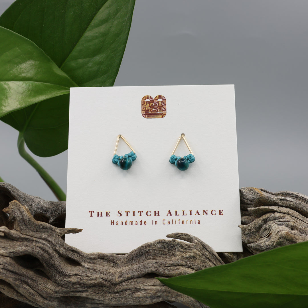 handmade blue tiger's eye triangle stud earrings in gold fill wire on a white card