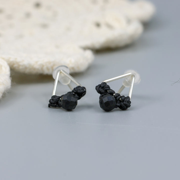 handmade triangle stud earrings sterling silver with black spinel beads close up view