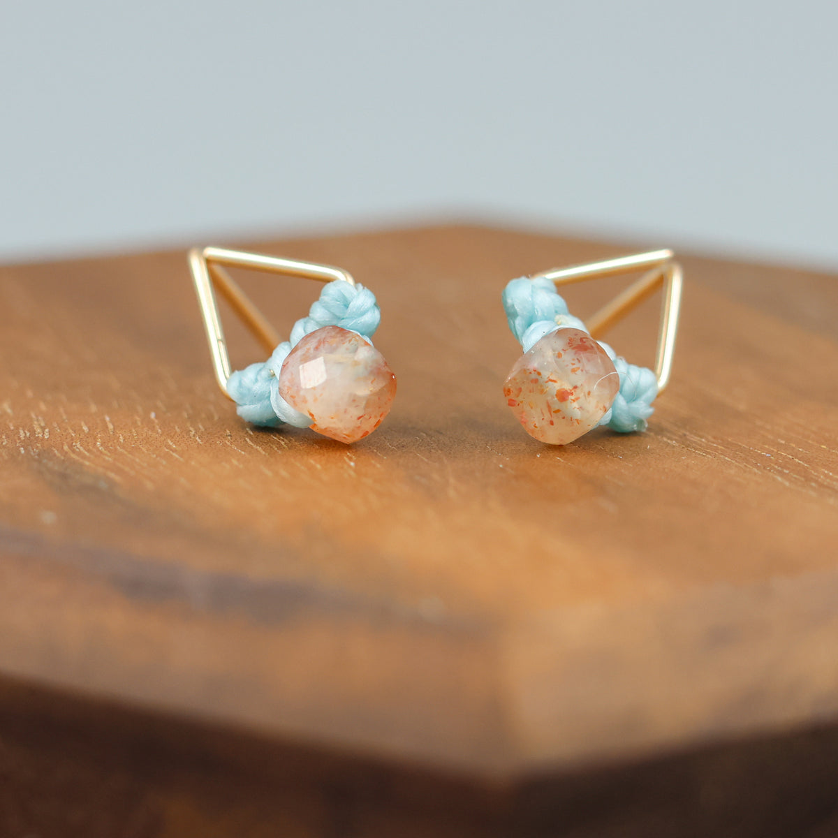 handmade triangle shaped earrings in gold fill with a sunstone bead