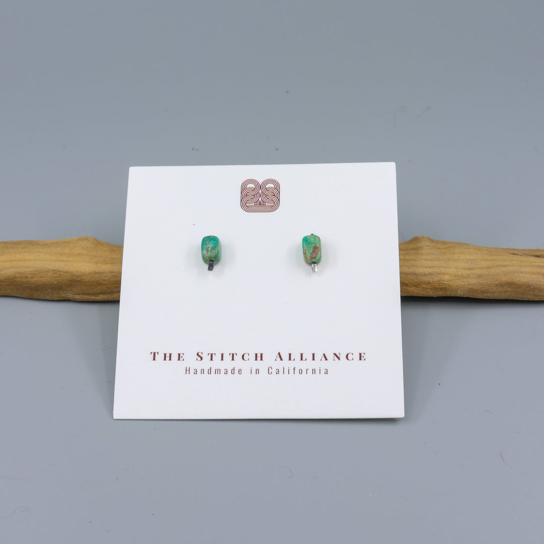 turquoise stud earrings hammered silver on a white card