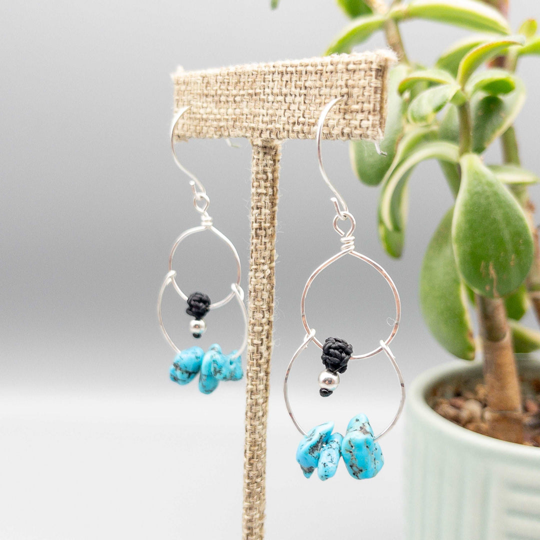 Double hoop sterling silver earrings with turquoise beads close up
