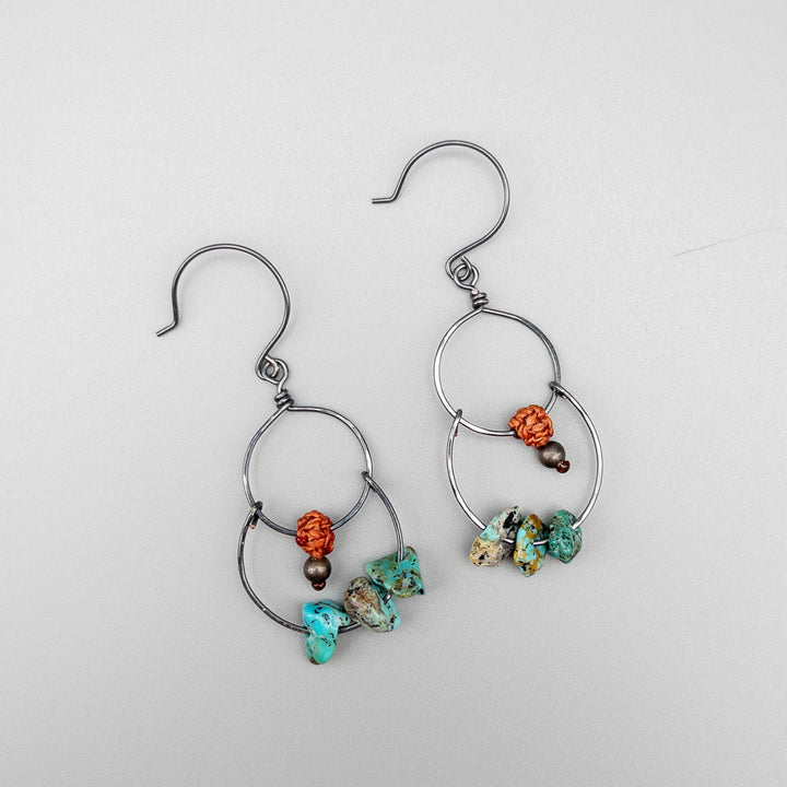 Double hoop earrings with vintage turquoise beads oxidized sterling silver on gray background