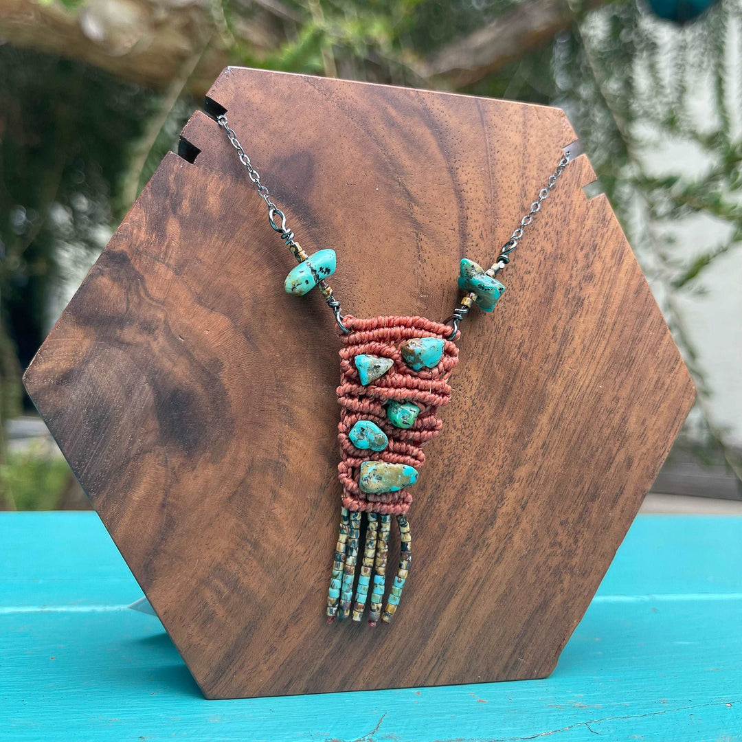 macrame necklace with vintage kingman turquoise beads sterling silver terracotta shown on a wood block