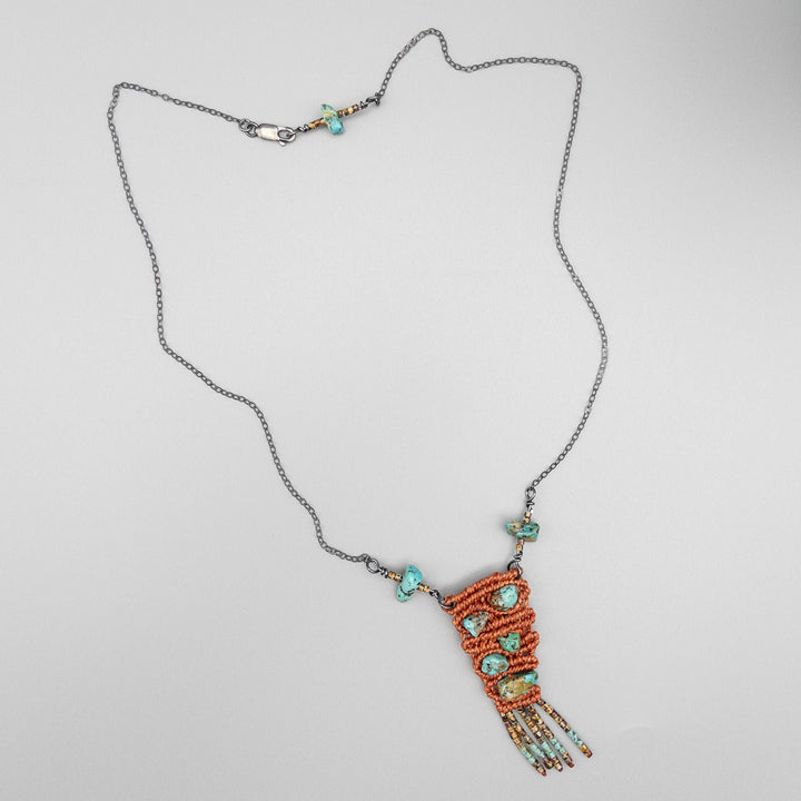 macrame necklace with vintage kingman turquoise beads sterling silver terracotta shown flat on gray background