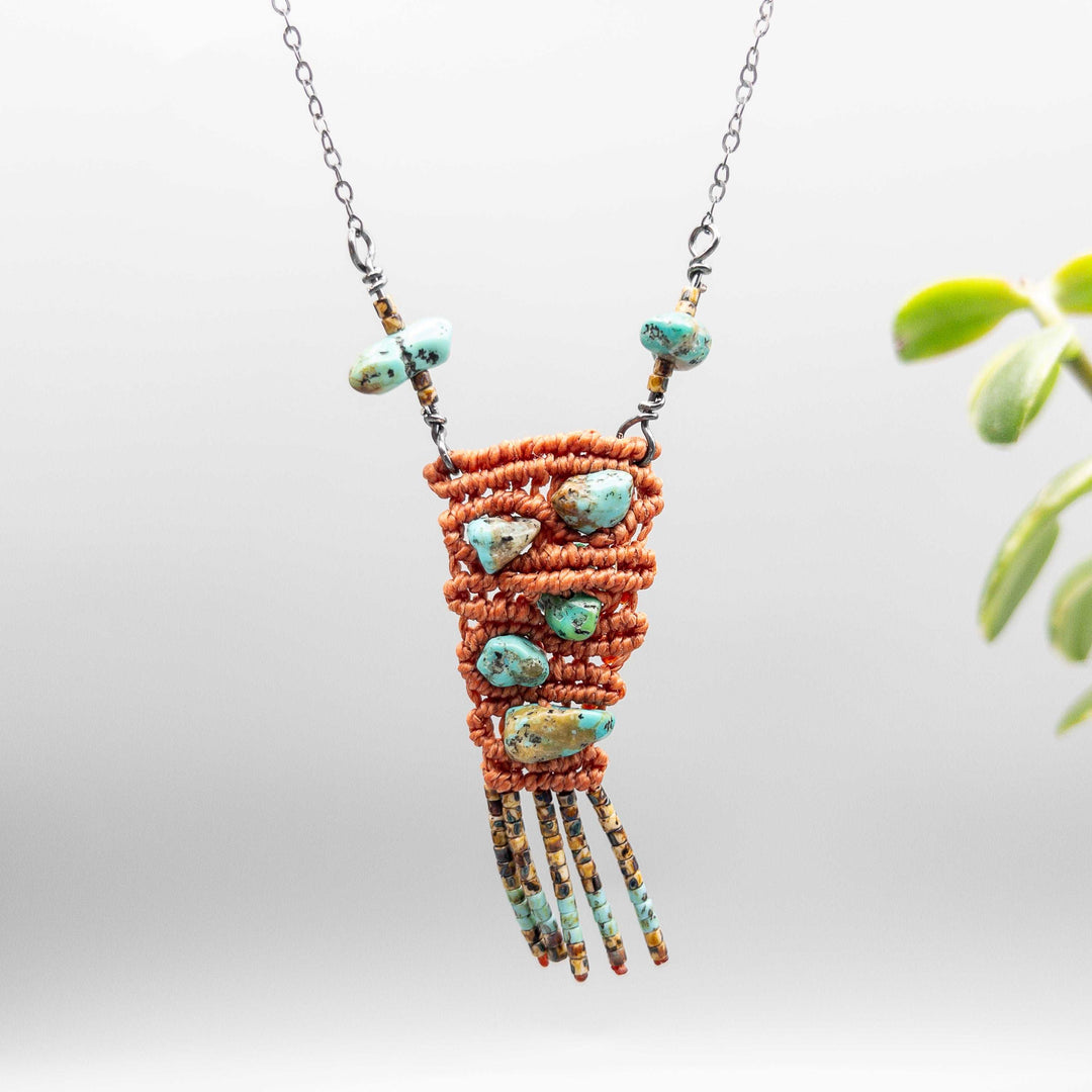 macrame necklace with vintage kingman turquoise beads sterling silver terracotta on gray background