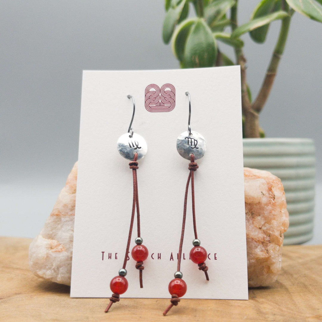 Virgo zodiac sterling silver stamped earrings with carnelian beads on a white background