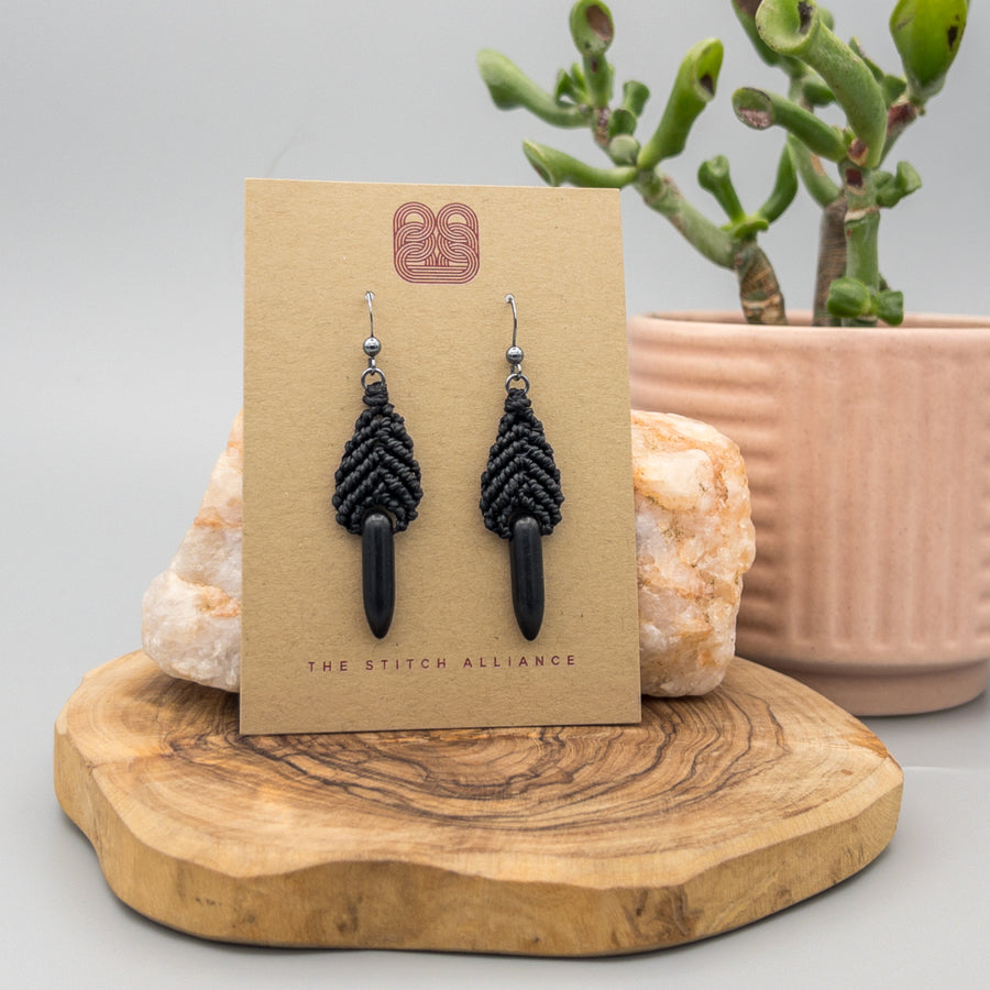Black leaf shaped macrame earrings with oxidized sterling silver earring wires and spike-shaped black howlite beads