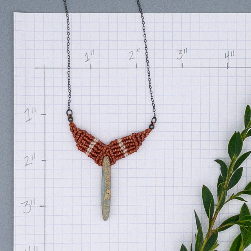 open arms macrame necklace with aqua terra jasper bead on white background